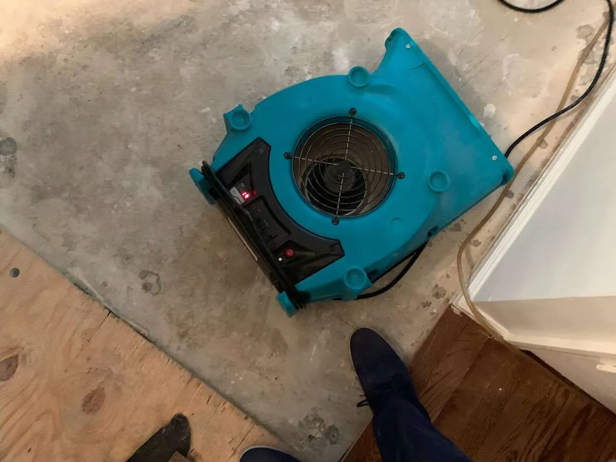 Air mover drying subfloor during Commercial Water Damage Restoration in Atlantic City